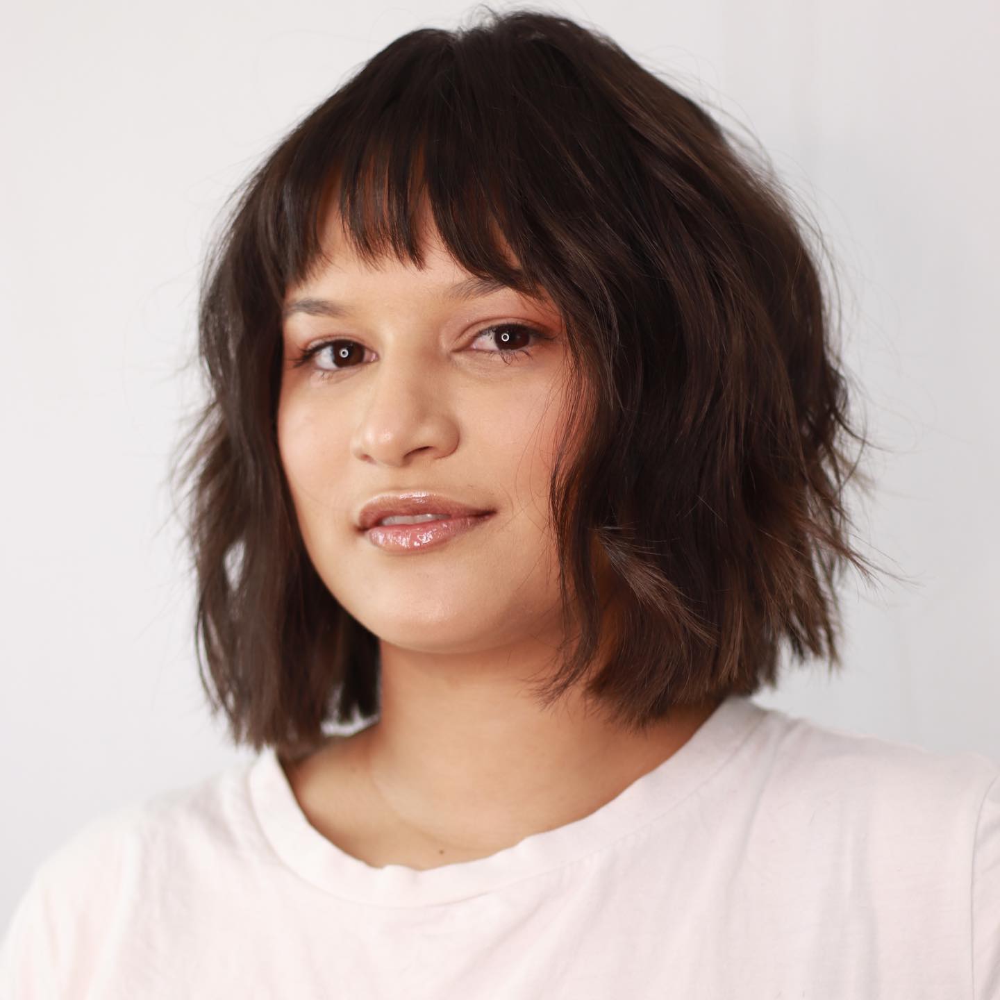 Sliced Bob with Short Bangs for a Round Face